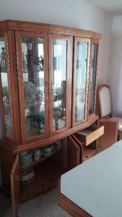 China cabinet. (top) Three glass shelf's (bottom) 1 self, two cabinet's one with a sliding drawer. (it will be empty) $850