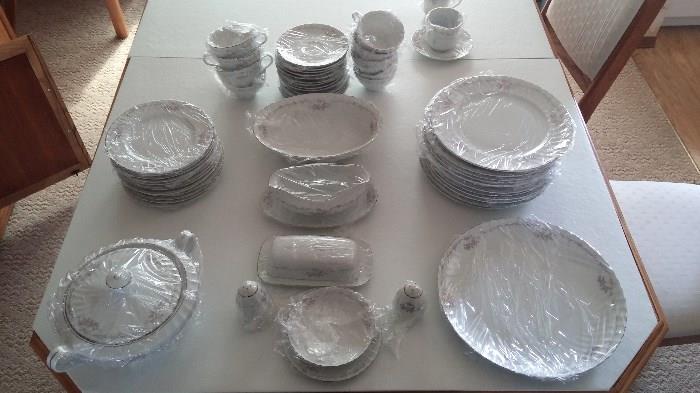 China set for 10, plates, serving dish, salt and pepper shaker, soup tureen, dessert plates, butter tray, gravy boat, bowl, coffee cups & saucers. $350