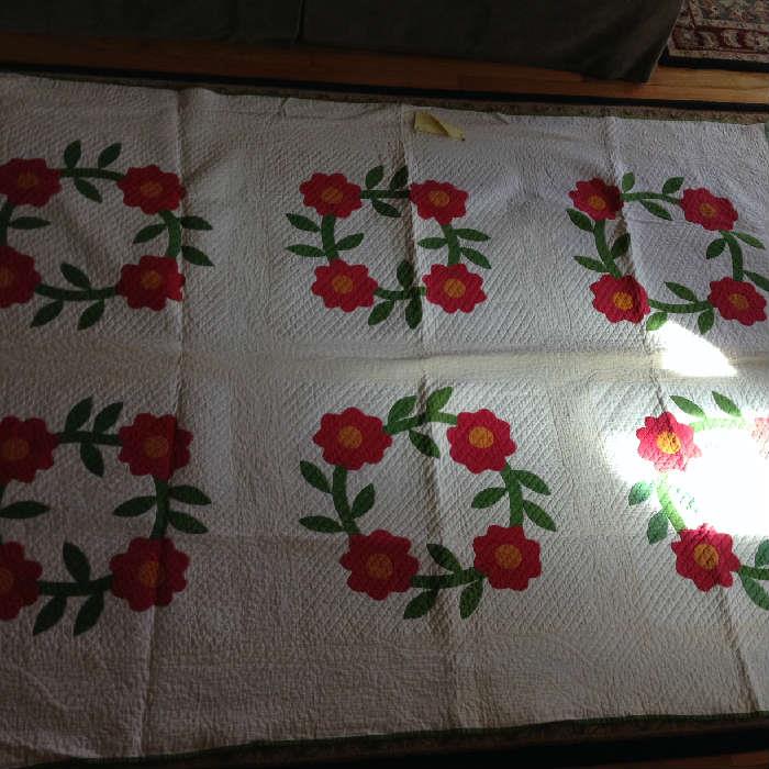 Rose Wreath, 1850-1890 Real Cotton used as batting, seeds visible. Beautiful quilting.