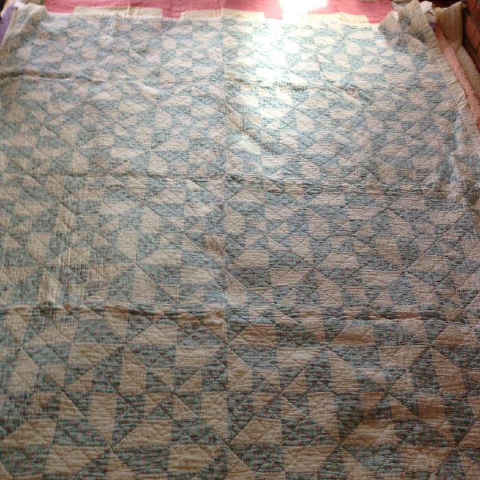 Pinwheel Quilt is blue and white. Nice quilting and fabric