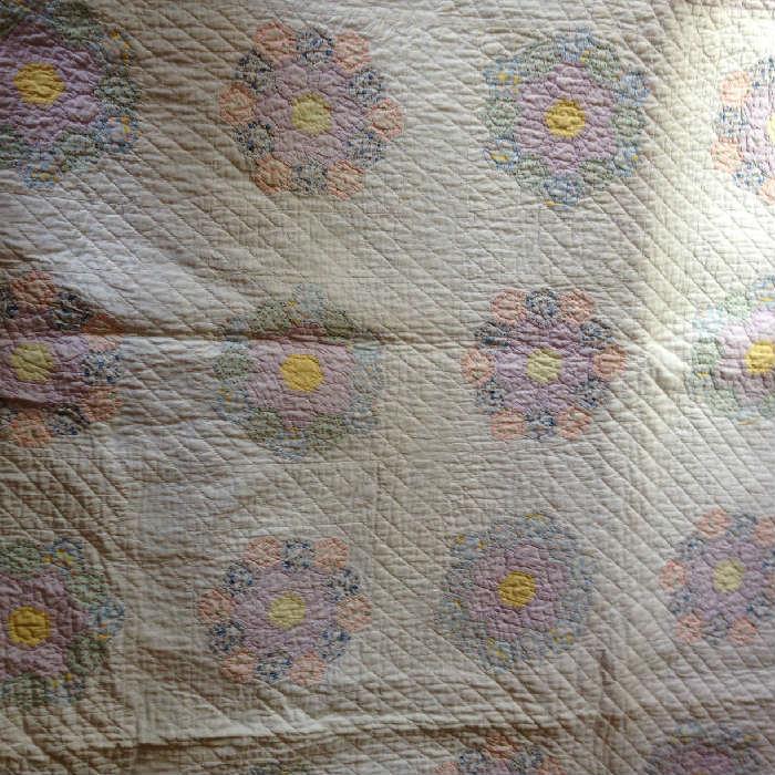Beautiful Grandmother's Flower Garden done in pastels with fine quilting