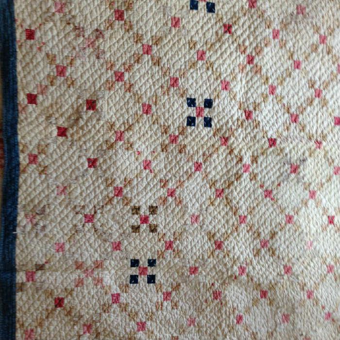 An Irish Chain quilt done in red, white, blue and browns. Great colors
