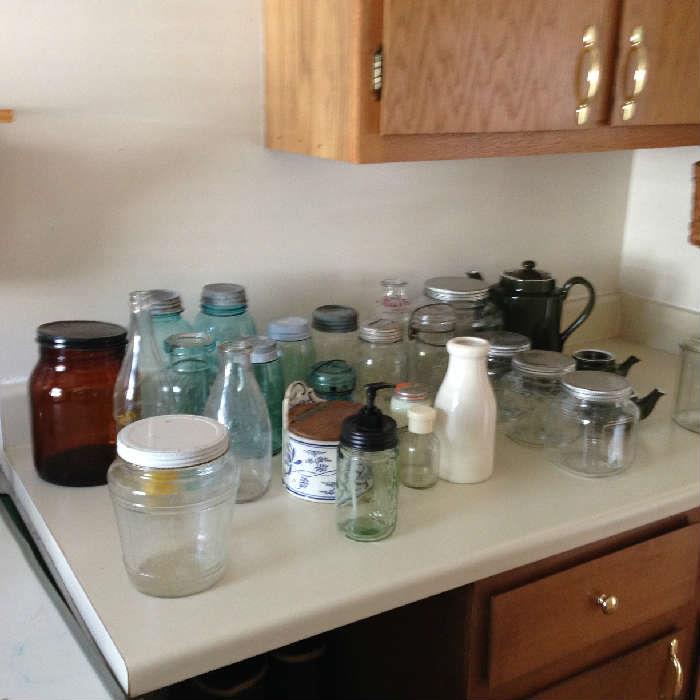blue, brown and clear jars, milk bottles from Cloverdale and Twin Pines, Hall Coffee Pot and Tea Pots, German Salt box and misc. storage jars