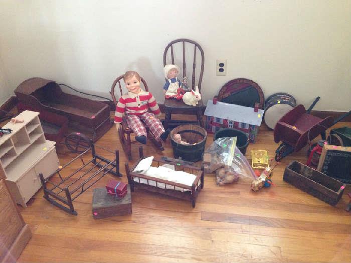 Small chairs, boxes, cupboard, alphabet wheel, rocking chair, and a great ventriloquist doll