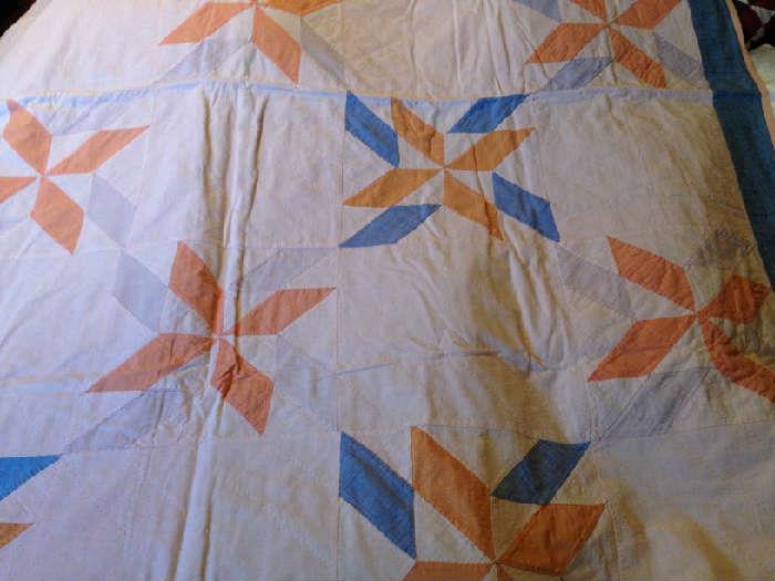 Pinwheel design in a nice light weight quilt. Very muted colors