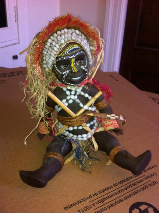 Vintage doll, African tribal costume and decoration.