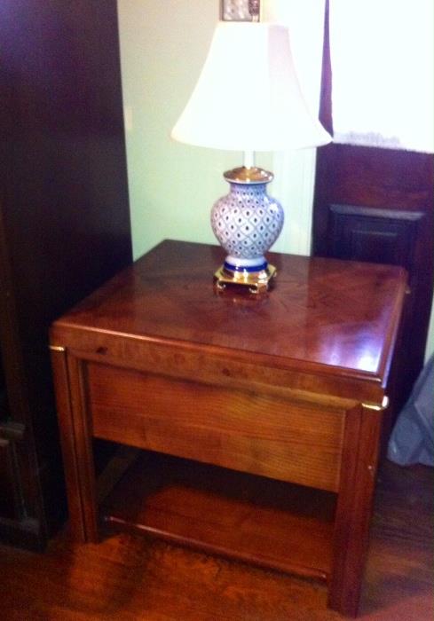 End table with blue & white lamp.