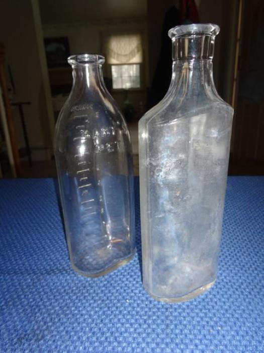 A pair of antique bottles.