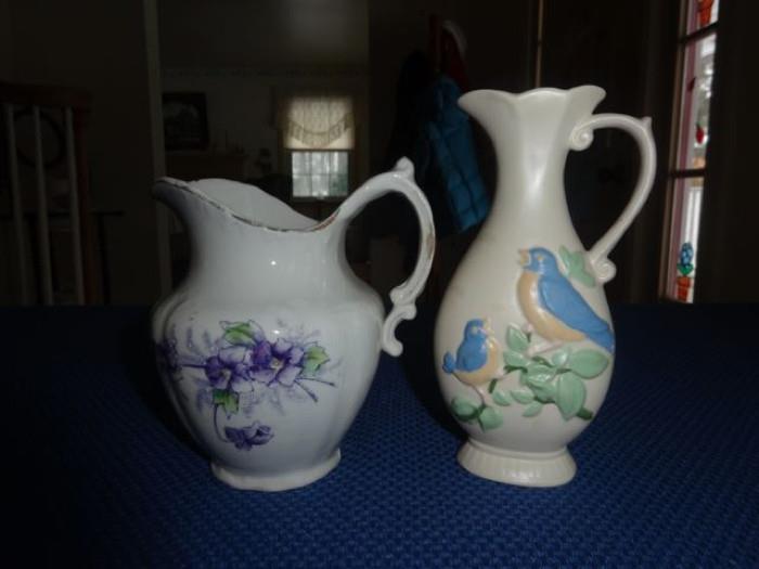 A pair of floral pitchers