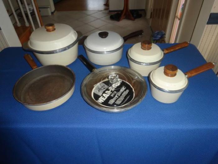A set of pots with lids