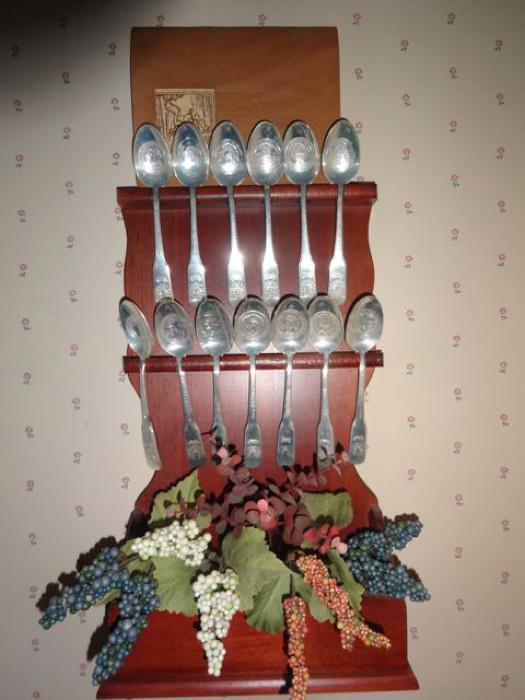 Decorative spoons and a display wrack.