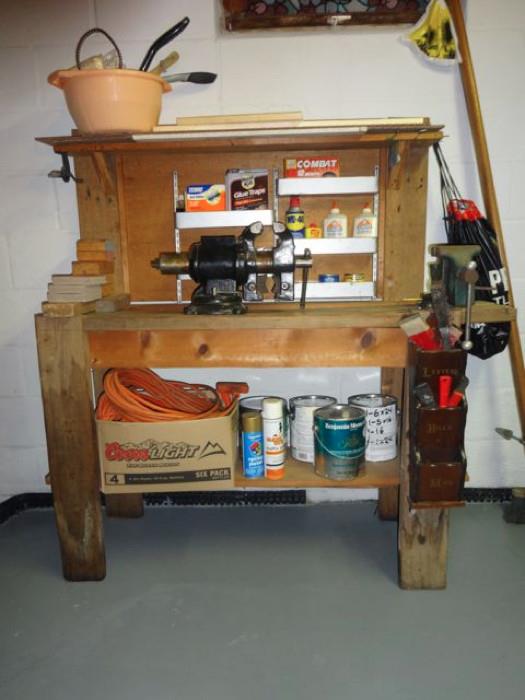A tool bench with various tools.