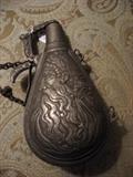 reverse of gun powder flask