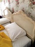 Vintage king bed headboard with adjoining twin mattresses