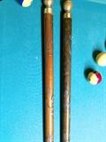 Carved pool cues