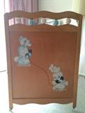 Detail of vintage baby crib (baby bunnies on telephone)