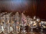 Gorgeous vintage gold-leaf glasses with gold rim detail; there are tumblers, cognac glasses, highball glasses, wine/port