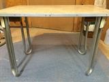 This mid-century child's table with curved feet-legs and formica top is great for playtime and study (or makes an unusual coffee table)