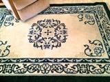 Rug in cream and blue by Millikin