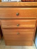 Small free-standing three-drawer oak cabinet with nice countertop