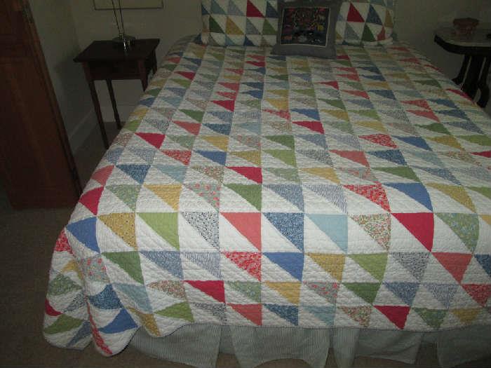 queen bed and beautiful quilt