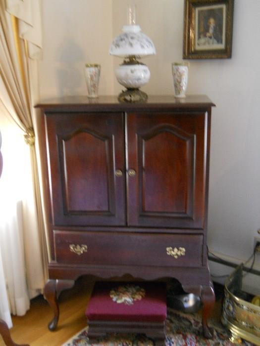 Queen Anne style entertainment cabinet, milkglass lamp, Nippon vases, vintage needlepoint foot stool, etc.