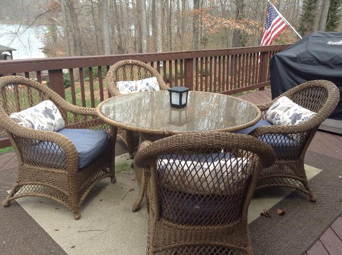 52" round glass top all-weather wicker table and 4 chairs (includes cushions)