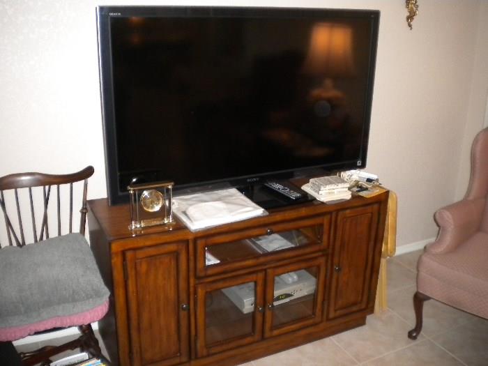 52" TV.   Wood entertainment stand.