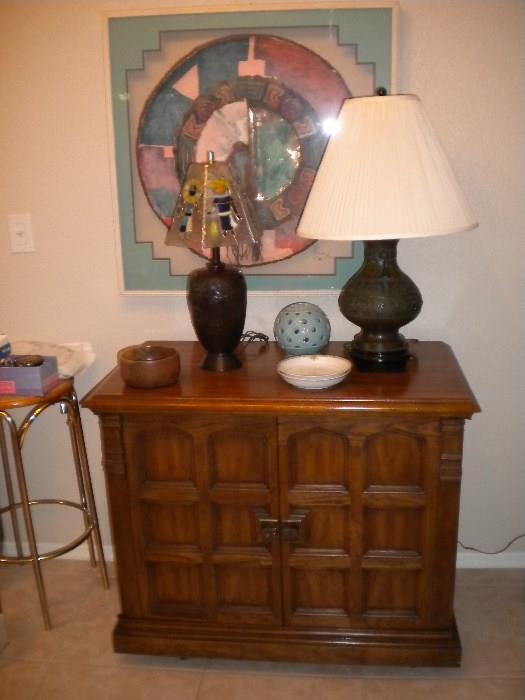 Vintage console TV in cabinet - doors swing open to expose television.