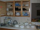 Mikasa plates in cupboard