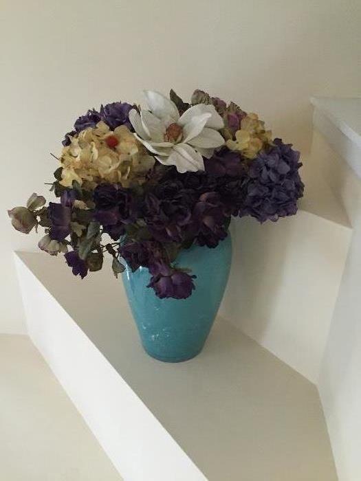 Large vase with custom made flower arrangement.