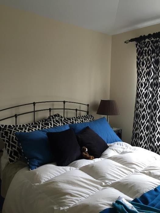 Metal head Board and matching shams, pillows and drapes all custom made. 