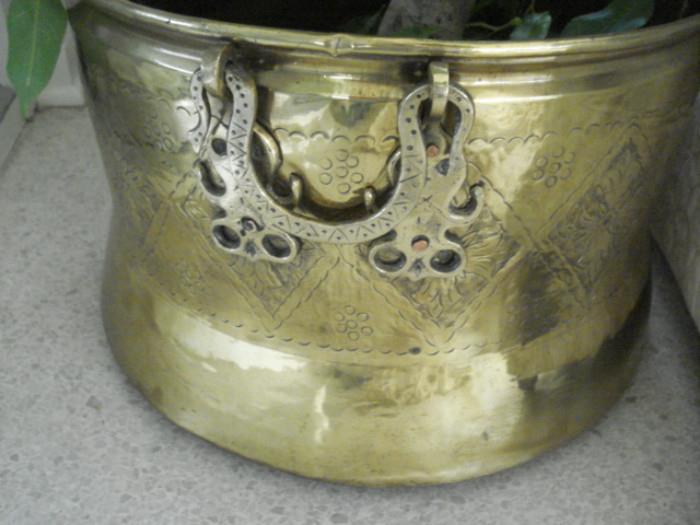 one of several large brass pots