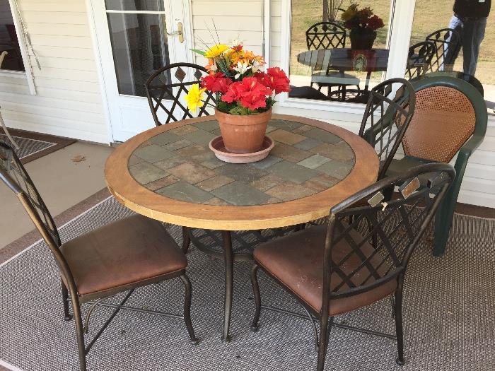 Round Patio Table with Four Metal Chairs