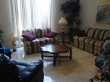 Sofa and Love Seat, Piecrust Coffee Table, Capidimonte Lamps, Artificial Trees