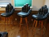 3 Bar Stools in the shape of hands with baseball bat legs