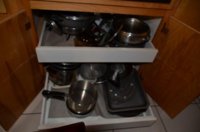 Cabinets are full of quality kitchenware! 