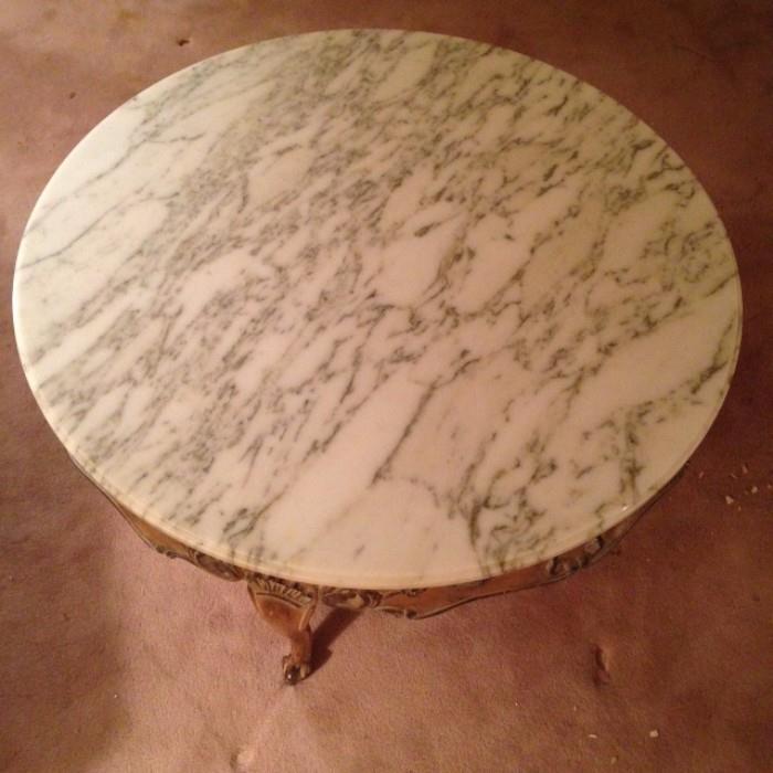 Italian marble with carved wood base.