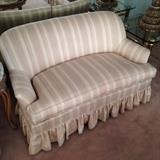 Compact upholstered sofa. 1 of 2.