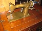 New Home Sewing Machine (1944-45) in cabinet
