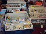 2 tackle boxes filled with fishing goodies. one trout box and one bass box 