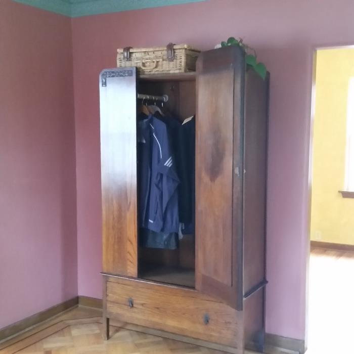 wood armoire, used as a coat closet