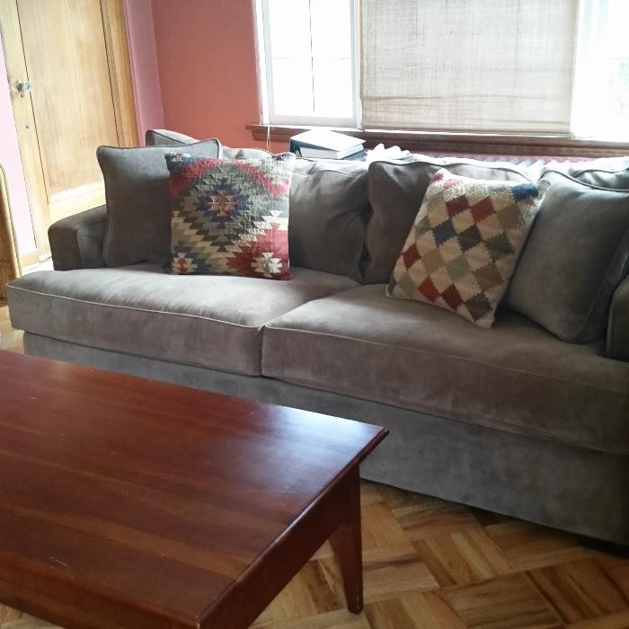 couch; decorative pillows; coffee table