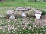 Stately concrete round table and curved benches. 