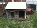 Awesome custom built dog house with its own window and easy access hinged roof. 