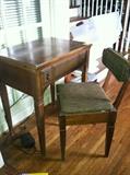 Antique sewing table and storage chair, sewing machine, notions, crafts, needle point, and yarn. 
