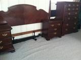 Gorgeous king bed, headboard, cherry nightstands, dresser, and chests. 
