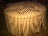 Beautiful round skirted ottoman. Add a tray and it's the perfect upholstered coffee table. 