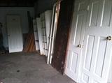 Solid 6 panel doors, small French doors,  shelving, and scrap wood. 