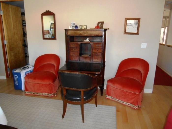 Sorry the owner just pulled these orange chairs BUT the Vintage Secretary is still for sale